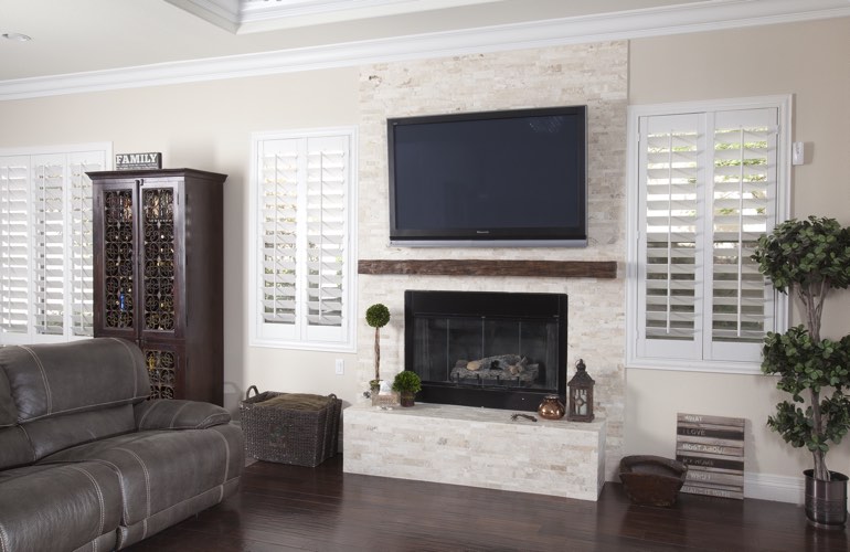 White plantation shutters in a Kingsport living room with solid hardwood floors.